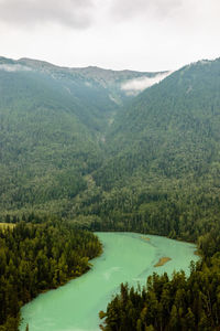 High angle view of river with mountains in background