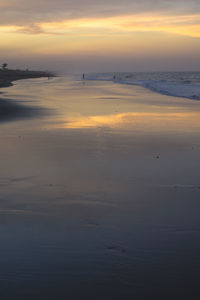 Scenic view of sea against sky at sunset