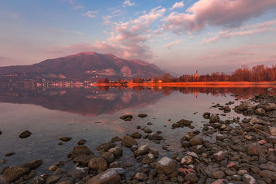 Scenic view of lake against sky during sunset