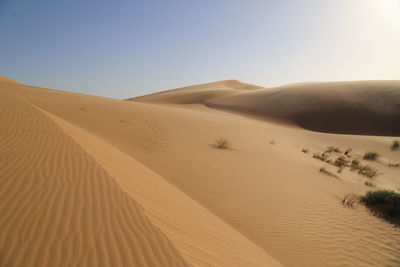 Scenic view of desert against clear sky