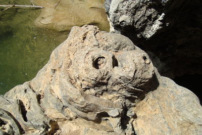 High angle view of rock formation in lake