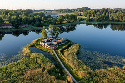 High angle view of lake by trees against sky