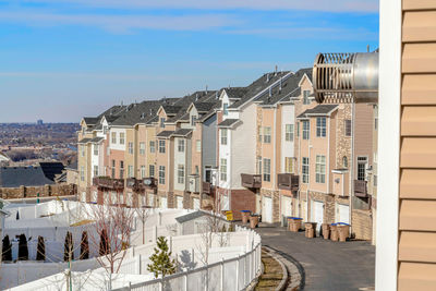 High angle view of street amidst buildings in town