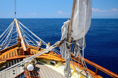 Cropped image of boat in sea against sky