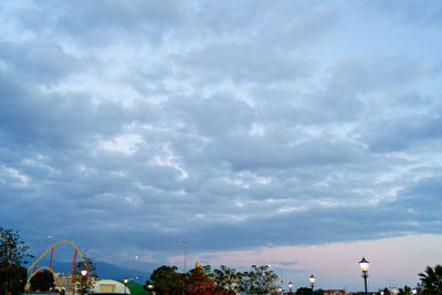 View of buildings against cloudy sky