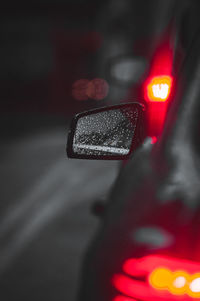 Close-up of car on road at night