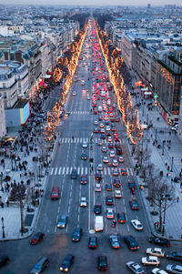 High angle view of busy street amidst buildings in city