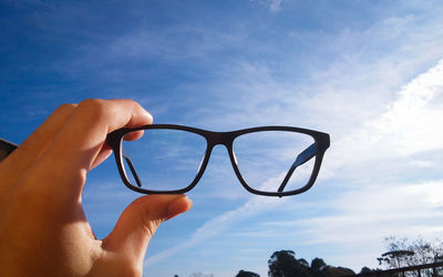 Scenic view of cloudy sky through eyeglasses