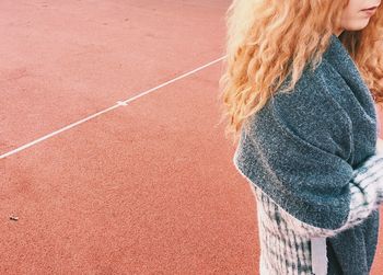 High angle view of woman standing on ground