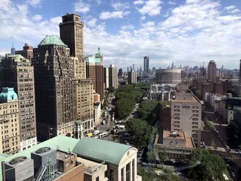 High angle view of buildings in city against sky