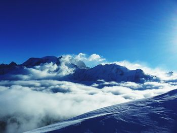 Scenic view of mountains against sky during winter