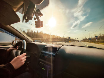 Cropped image of man driving car