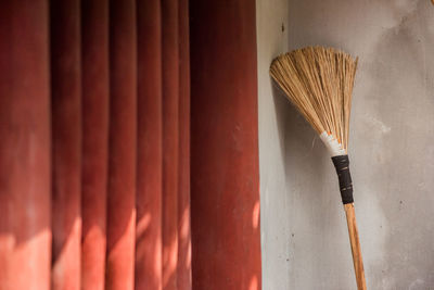 Close-up of paintbrushes against wall