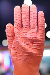 Close-up of human hand against blurred background