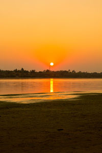 Scenic view of sunset over lake