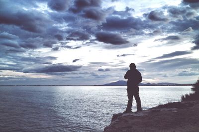 Scenic view of sea against cloudy sky