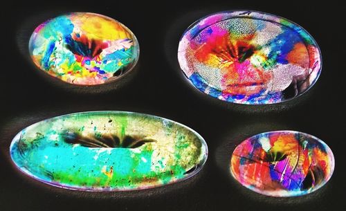 High angle view of multi colored glass on table