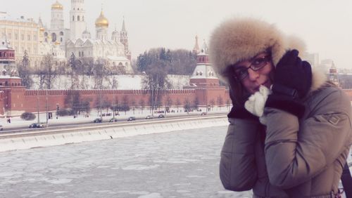 Portrait of woman standing in city