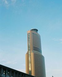 Low angle view of modern building against sky