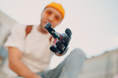 High angle view of boy holding camera
