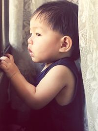 Portrait of cute boy looking away