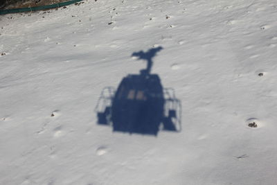 High angle view of shadow on sand