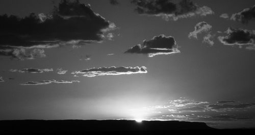 Scenic view of mountains against cloudy sky