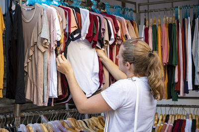 Full length of woman standing at store