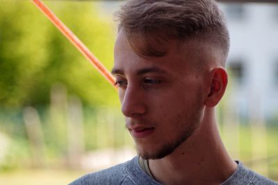 Portrait of young man looking away