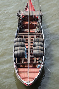 High angle view of barrels in boat on lake