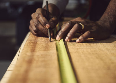 Man working on wooden table