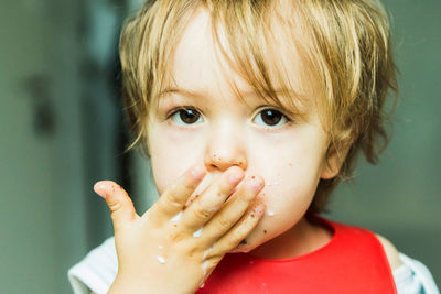 Close-up portrait of boy eating food