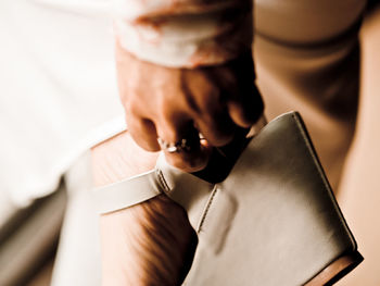 Close-up of man holding hands