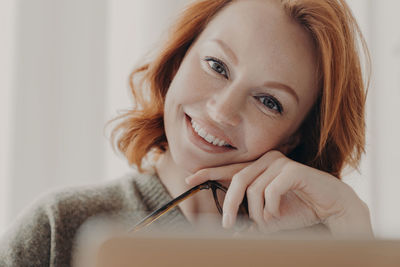 Woman working on laptop at home