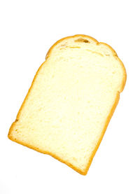 Close-up of bread against white background