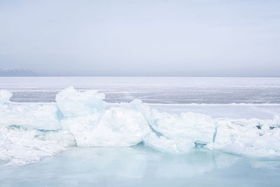 Scenic view of sea against sky during winter