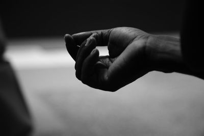 Close-up of human hand against blurred background