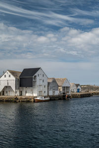 Small harbour with wooden houses on the island of runde