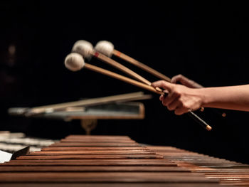 Cropped image of person playing piano