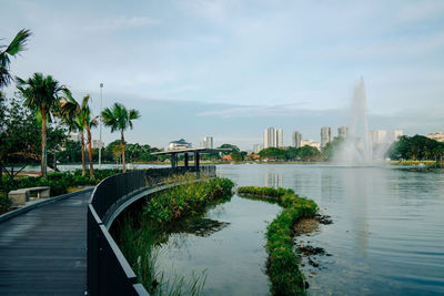 Scenic view of river against cloudy sky