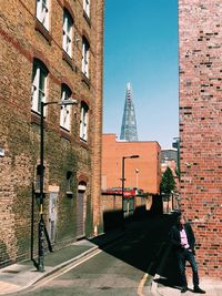 View of street and buildings against sky