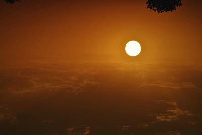 Scenic view of moon in sky at sunset