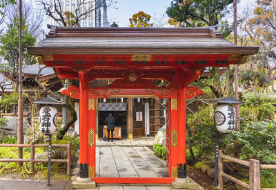 Entrance of temple against building