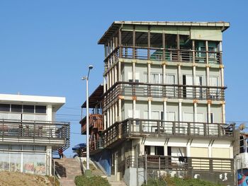 Low angle view of building against clear blue sky