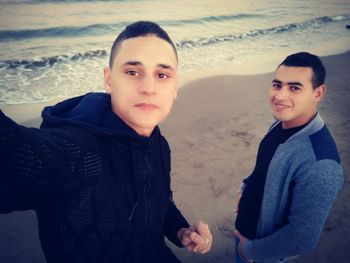 Portrait of young man standing on land