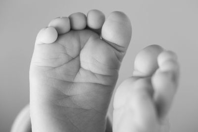 Low section of toddler with bare feet