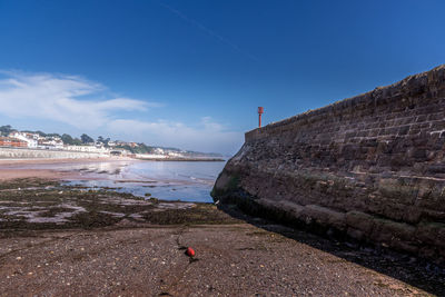 Scenic view of sea against blue sky