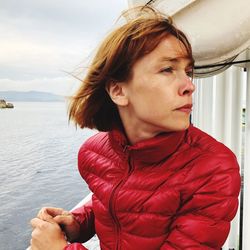 Close-up of woman standing against sky