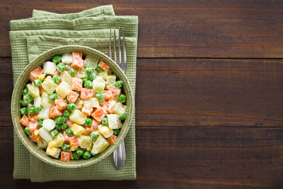 Directly above shot of chopped vegetables in bowl on table