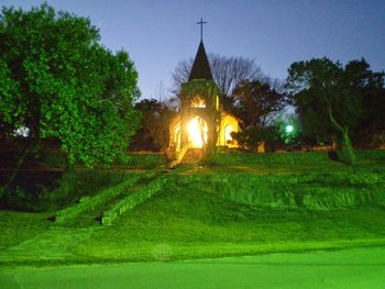Illuminated church in lawn